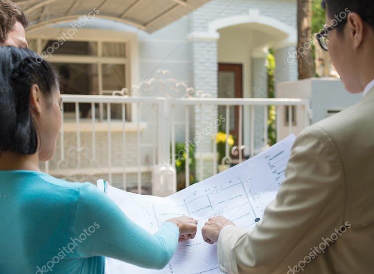 Couple in front of a custom home